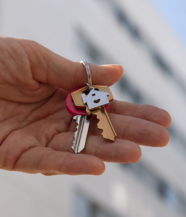 hand-holding-keys-outdoors